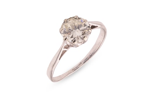 Lot A diamond solitaire ring, featuring an old...