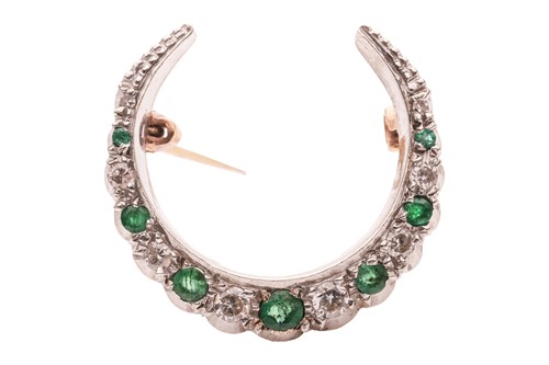 Lot 276 - An emerald and diamond crescent brooch in 9ct...