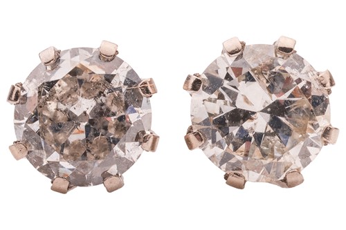 Lot A pair of diamond stud earrings, each...