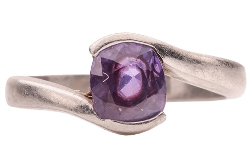 Lot A purple sapphire crossover ring, featuring a...