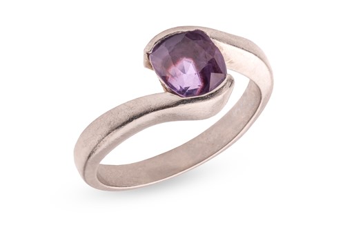 Lot A purple sapphire crossover ring, featuring a...