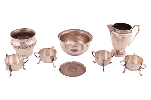 Lot 468 - A set of four silver cauldron form tyg table...
