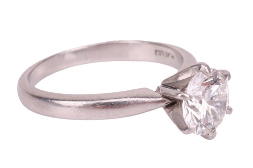 Lot A diamond solitaire ring, centred with a round...