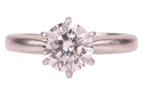 Lot A diamond solitaire ring, centred with a round...