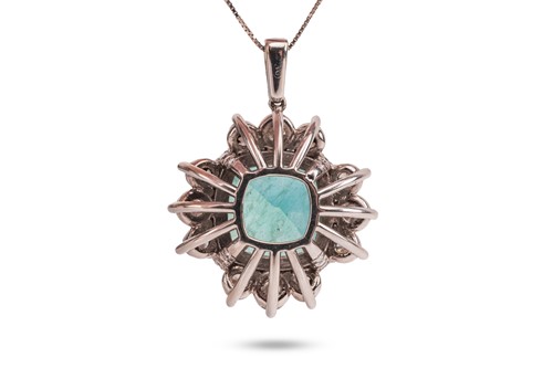 Lot An emerald and diamond pendant, comprising a...