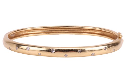 Lot A diamond-set hinged bangle, the front...