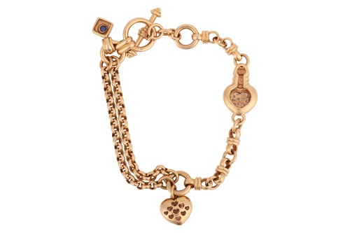 Lot A diamond-set heart charm bracelet in 18ct...