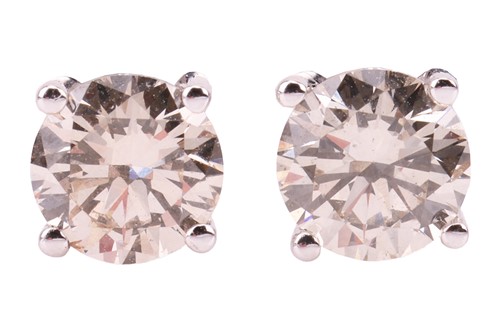 Lot 310 - A pair of diamond stud earrings, each...
