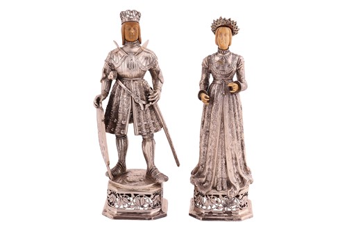 Lot 482 - A pair of silver and ivory-mounted figures of...