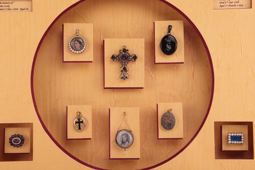 Lot 288 - A framed collection of Victorian mourning...