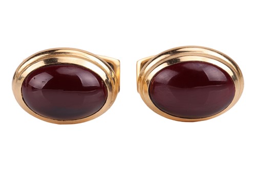 Lot A pair of 18ct gold and garnet cufflinks, each...