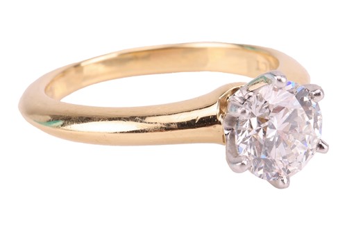 Lot 199 - Tiffany & Co. - a diamond solitaire ring, with...