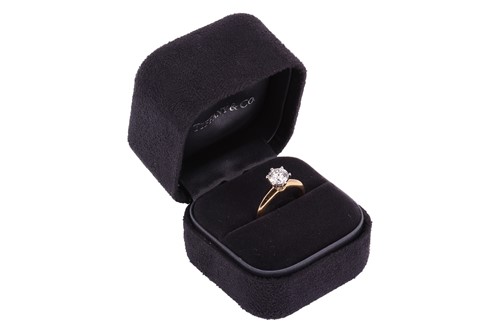 Lot 199 - Tiffany & Co. - a diamond solitaire ring, with...