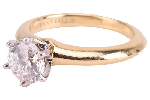 Lot 199 - Tiffany & Co. - a diamond solitaire ring, with...
