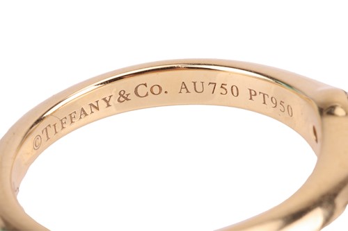 Lot 199 - Tiffany & Co. - a diamond solitaire ring, with...