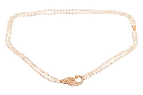 Lot 154 - A long double-row cultured pearl necklace with...