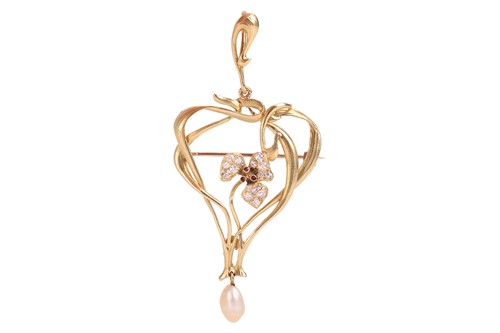 Lot An Art Nouveau iris pendant brooch, the flower...