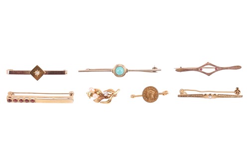 Lot 22 - A collection of gold and other metal bar...