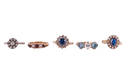 Lot 39 - Five gold and gem-set rings including a paste...