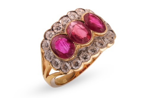 Lot A ruby and diamond cluster ring, set with...