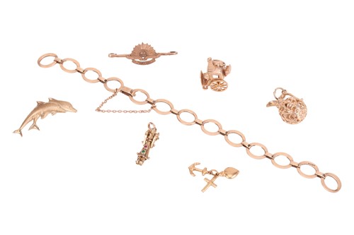 Lot 48 - A bracelet and a collection of charms, the...
