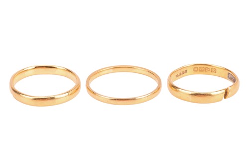Lot 3 - Three 22ct gold wedding bands; all comprising...
