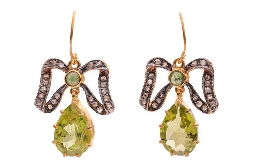 Lot 136 - A pair of gem-set bow earrings, each claw-set...