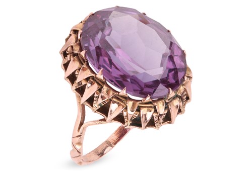Lot 65 - An Egyptian gold and oval synthetic...