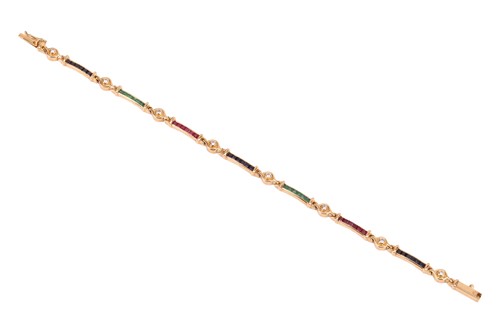 Lot 190 - A diamond and gem-set bracelet, in the form of...
