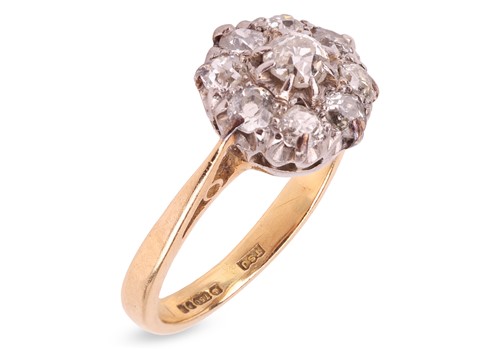 Lot 27 - An 18ct gold and diamond cluster ring, centred...