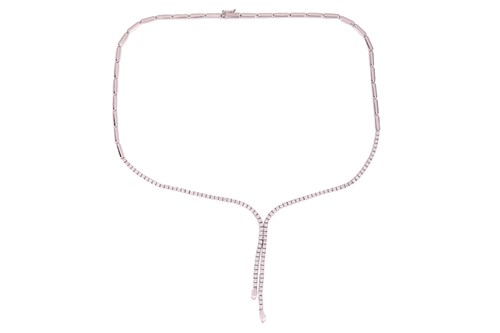 Lot 105 - A diamond-set lariat style necklace, with an...