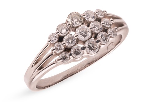 Lot 274 - A diamond cluster ring in 18ct white gold,...