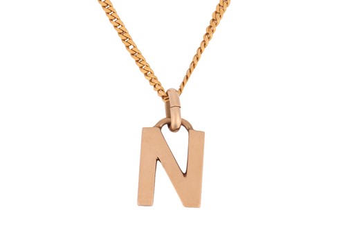 Lot 143 - A high carat chain and a Gucci alphabet...