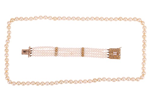 Lot 74 - A cultured pearl and citrine bracelet in 9ct...