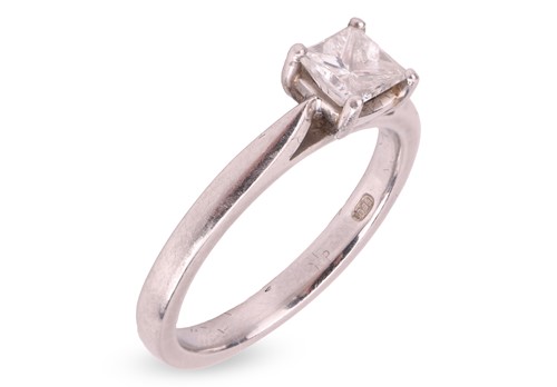 Lot 179 - A diamond solitaire in platinum, claw-set with...