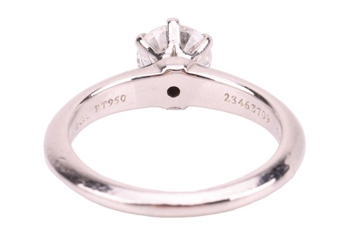 Lot 293 - Tiffany & Co. - a diamond solitaire ring in...