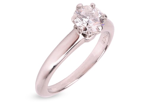 Lot 293 - Tiffany & Co. - a diamond solitaire ring in...