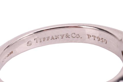 Lot 293 - Tiffany & Co. - a diamond solitaire ring in...