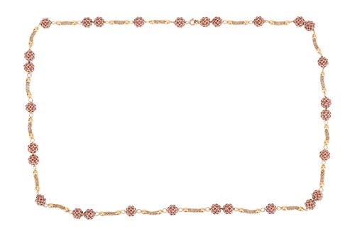 Lot 157 - A long fancy link necklace with ruby spacers,...