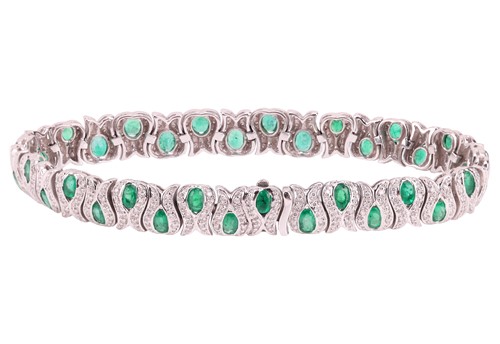 Lot 229 - An emerald and diamond link bracelet, the...