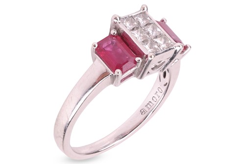 Lot 131 - A diamond and ruby cluster ring, centred with...