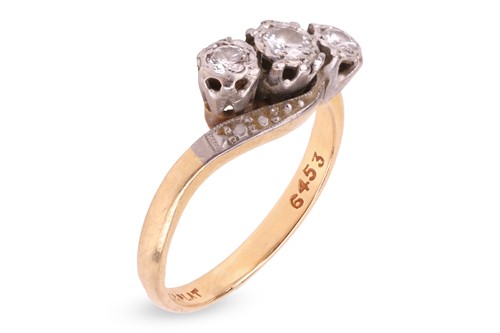 Lot 202 - A three-stone diamond ring, of bypass design,...