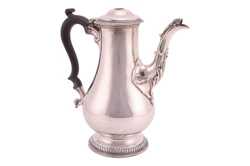 Lot 449 - A George III silver coffee pot, the hinged...
