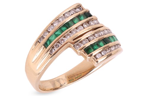 Lot 162 - An emerald and diamond crossover ring,...