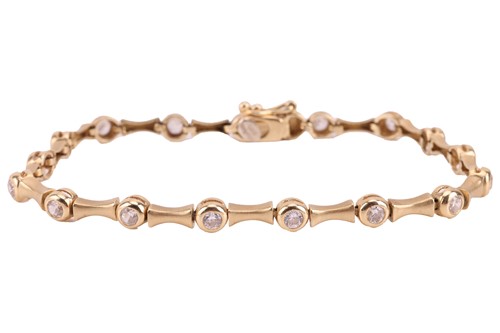 Lot 275 - A gem-set bracelet, set with sixteen bezel-set...