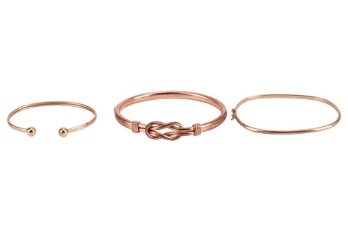 Lot 147 - Three bangles, comprising a 9ct rose gold...