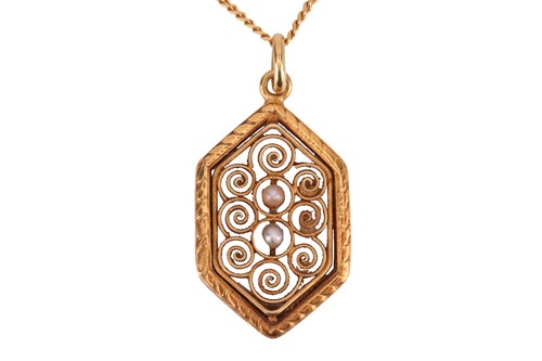 Lot 91 - A filigree pendant, the six-sided panel...
