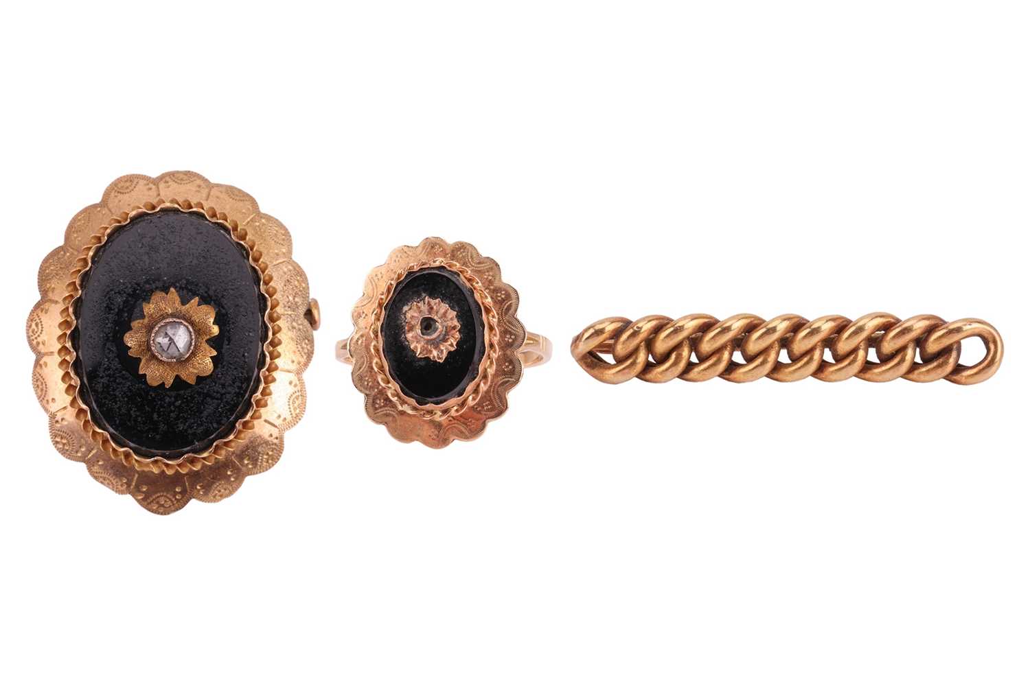 Lot 224 - An onyx mourning brooch and ring set, and a...