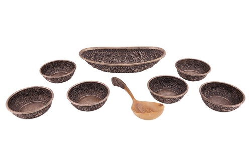 Lot 461 - A Balinese white metal oblong embossed rice...