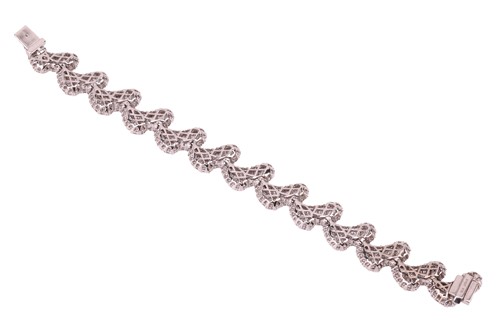 Lot A diamond-set bracelet of stylised petal...
